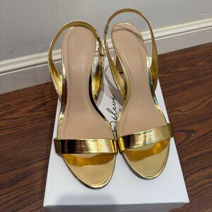 Gold chunky 22élevé heels from Saks Fifth Avenue